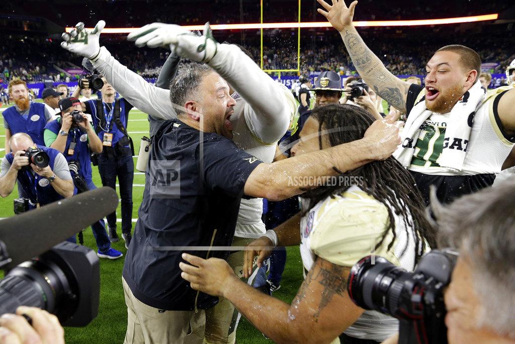 Michael Wyke Baylor head coach Matt Rhule, center left, embraces his players as they celebrate their 45-38 win over Vanderbilt after the Texas Bowl NCAA college football game, Thursday, Dec. 27, 2018, in Houston. (AP Photo/Michael Wyke)