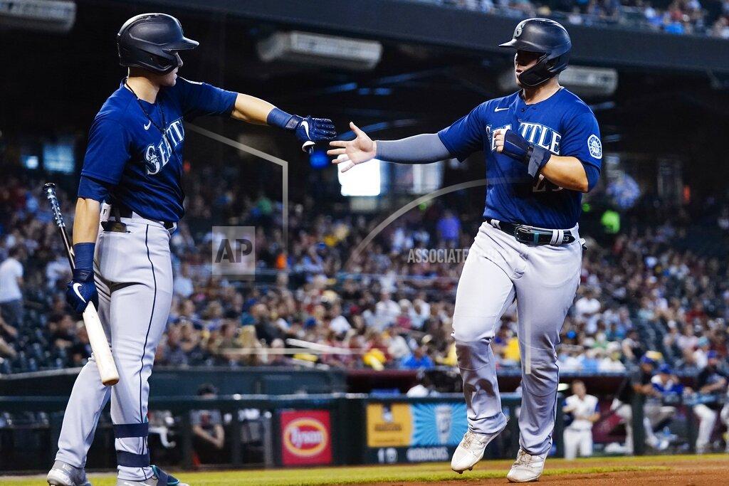 Ross D. Franklin Seattle Mariners' Ty France, right, celebrates with teammate Jarred Kelenic, left, after scoring a run against the Arizona Diamondbacks during the fourth inning of a baseball game Sunday, Sept. 5, 2021, in Phoenix. (AP Photo/Ross D. Franklin)