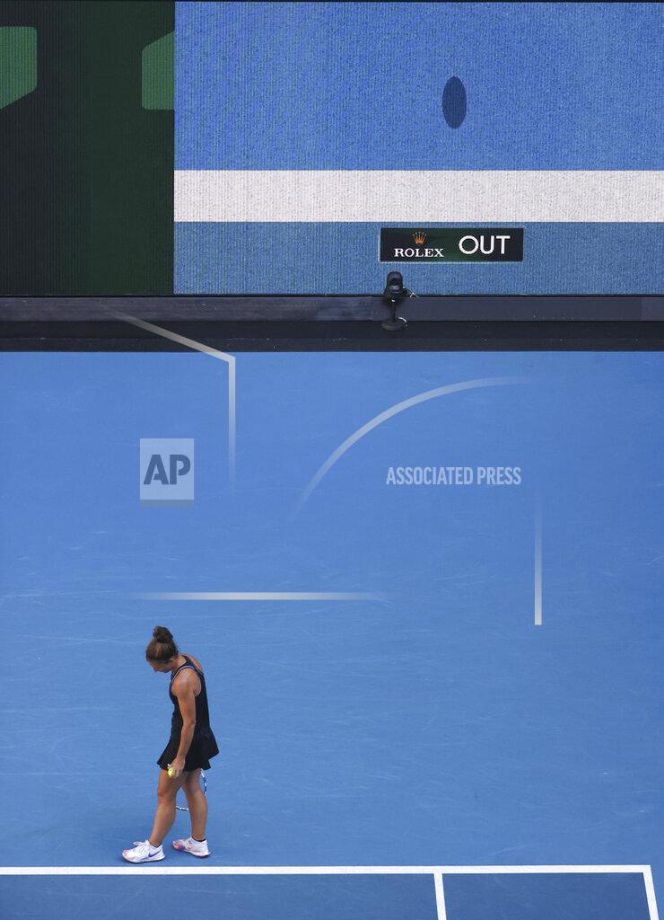 Hamish Blair Italy's Sara Errani waits as a video screen shows the line decision during her second round match agains Venus Williams of the US at the Australian Open tennis championship in Melbourne, Australia, Wednesday, Feb. 10, 2021. Eliminating all line judges and removing the human element from officiating at the Australian Open might have been a necessary step to reduce the number of people on court amid a pandemic. It also might be good for the integrity of the game, because getting every call right matters so much to players and fans. (AP Photo/Hamish Blair)