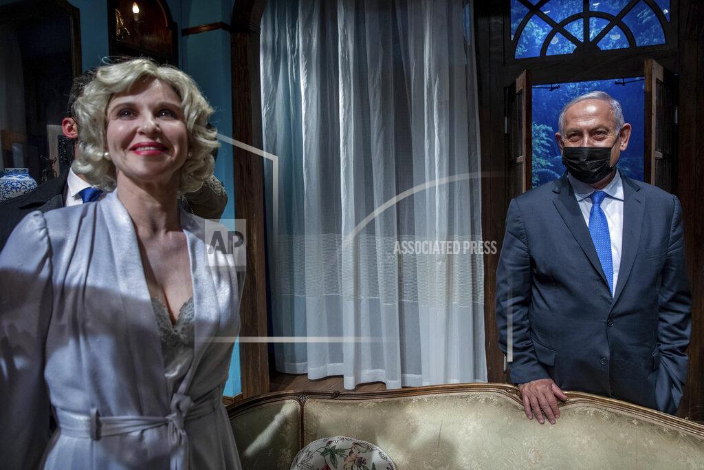 Ohad Zwigenberg Israeli Prime Minister Benjamin Netanyahu meets Israeli actress Carmit Mesilati Kaplan, right, during a visit to the Khan theater ahead of the re-opening of the culture sector, in Jerusalem on Tuesday, Feb. 23, 2021. (Ohad Zwigenberg/Pool Photo via AP)