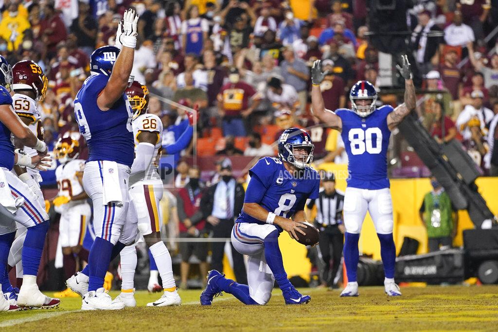 Alex Brandon New York Giants quarterback Daniel Jones (8) stands up and running in to score a touchdown against the Washington Football Team during the first half of an NFL football game, Thursday, Sept. 16, 2021, in Landover, Md. (AP Photo/Alex Brandon)