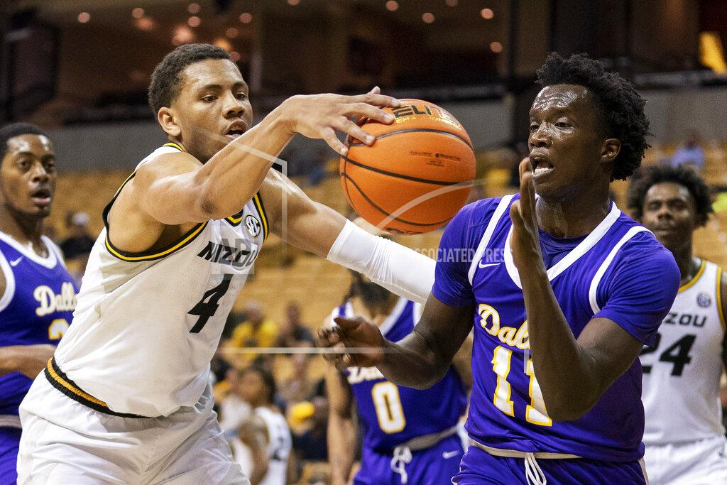 L.g. Patterson Missouri's Javon Pickett, left, battles Paul Quinn's Anei Anei-Yor, right, for a loose ball during the second half of an NCAA college basketball game Monday, Nov. 29, 2021, in Columbia, Mo. Missouri won 91-59. (AP Photo/L.G. Patterson)