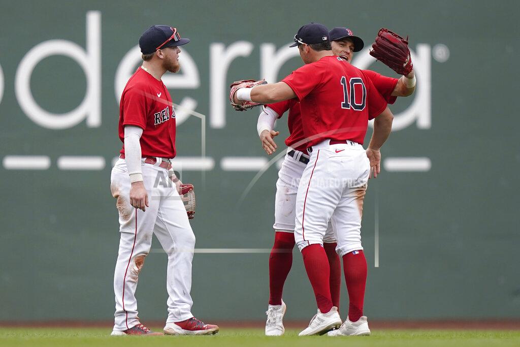Steven Senne Boston Red Sox's Alex Verdugo, left, Enrique Hernandez, behind right, and Hunter Renfroe (10) celebrate after beating the New York Yankees 5-4 in a baseball game, Sunday, July 25, 2021, in Boston. (AP Photo/Steven Senne)