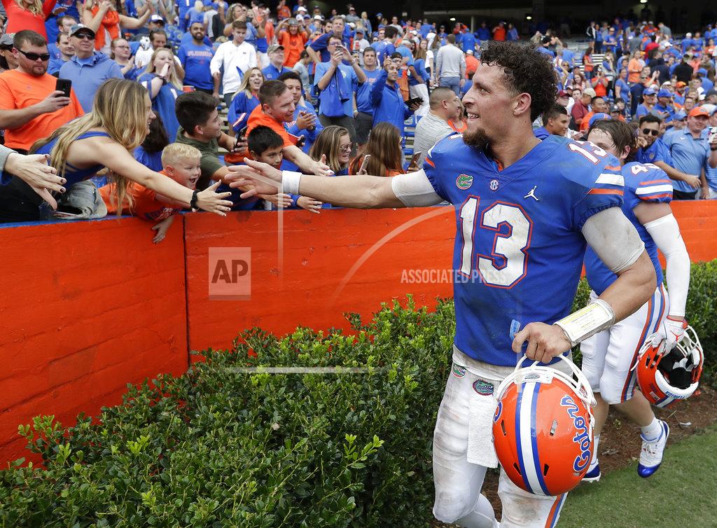 John Raoux Florida quarterback Feleipe Franks (13) celebrates with fans after defeating South Carolina in an NCAA college football game, Saturday, Nov. 10, 2018, in Gainesville, Fla. (AP Photo/John Raoux)