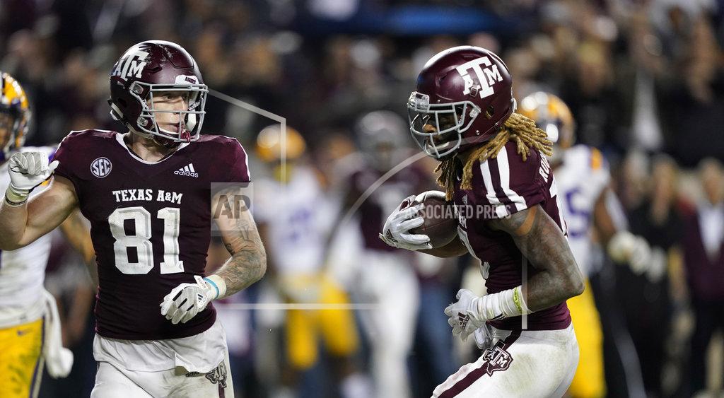 David J. Phillip Texas A&M wide receiver Kendrick Rogers, right, catches a pass for a two-point conversion during the seventh overtime of an NCAA college football game against LSU Saturday, Nov. 24, 2018, in College Station, Texas. Texas A&M won 74-72. (AP Photo/David J. Phillip)