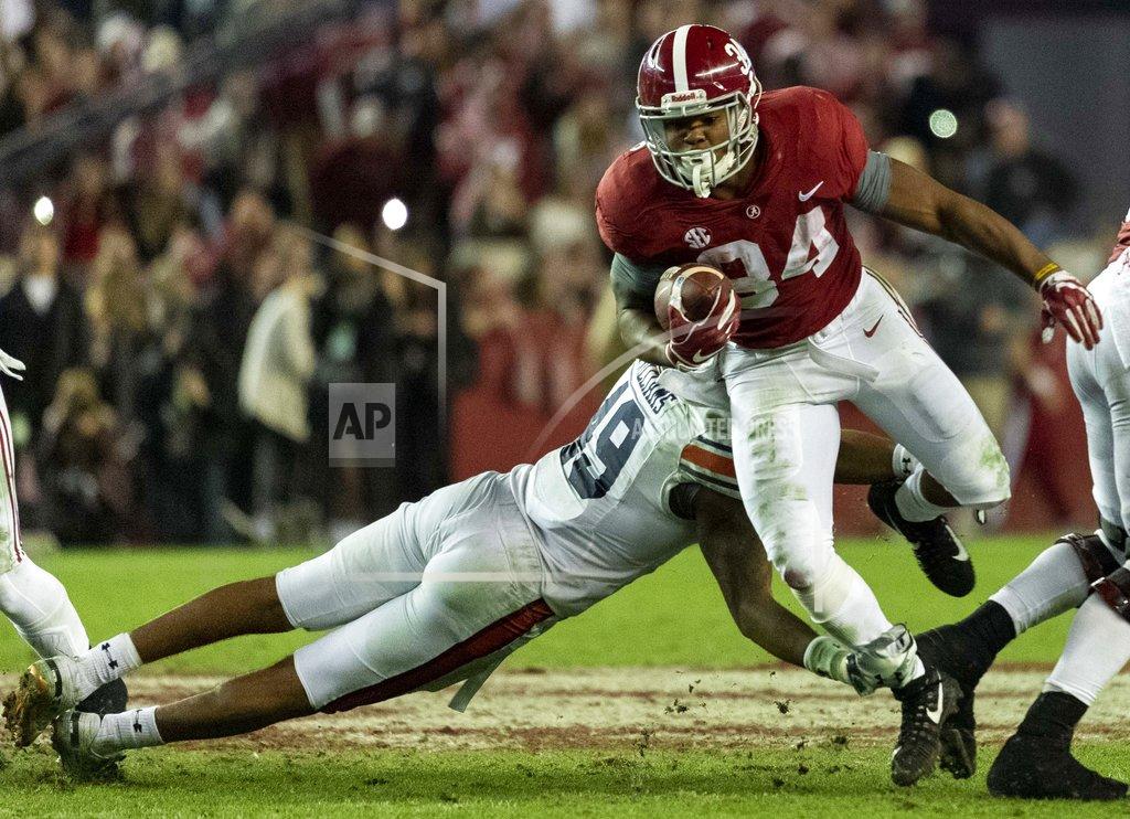 Vasha Hunt Alabama running back Damien Harris (34) gets past Auburn linebacker Darrell Williams (49) during the second half of an NCAA college football game, Saturday, Nov. 24, 2018, in Tuscaloosa, Ala. (AP Photo/Vasha Hunt)