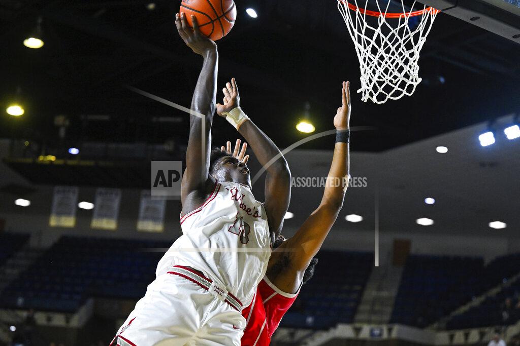 Terrance Williams Saint Joseph's forward Rasheer Fleming goes to the basket and is fouled by Houston forward Reggie Chaney during the second half of an NCAA college basketball game at the Veterans Classic, Friday, Nov. 11, 2022, in Annapolis, Md. (AP Photo/Terrance Williams)