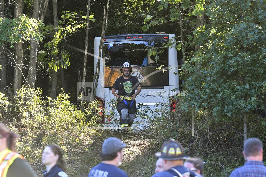 Jacqueline Dormer First responders work the scene after a Premiere #1 Limousine bus crashed into a wooded area off I-81 in Frailey Township, Pa., on Sunday, Sept. 19, 2021. The bus was traveling on I-81 south and came off the Hegins exit ramp, crossing through the divider on Rt. 25 and crashing into a wooded area off Rt. 25 where it came to a stop. (Jacqueline Dormer/Republican-Herald via AP)
