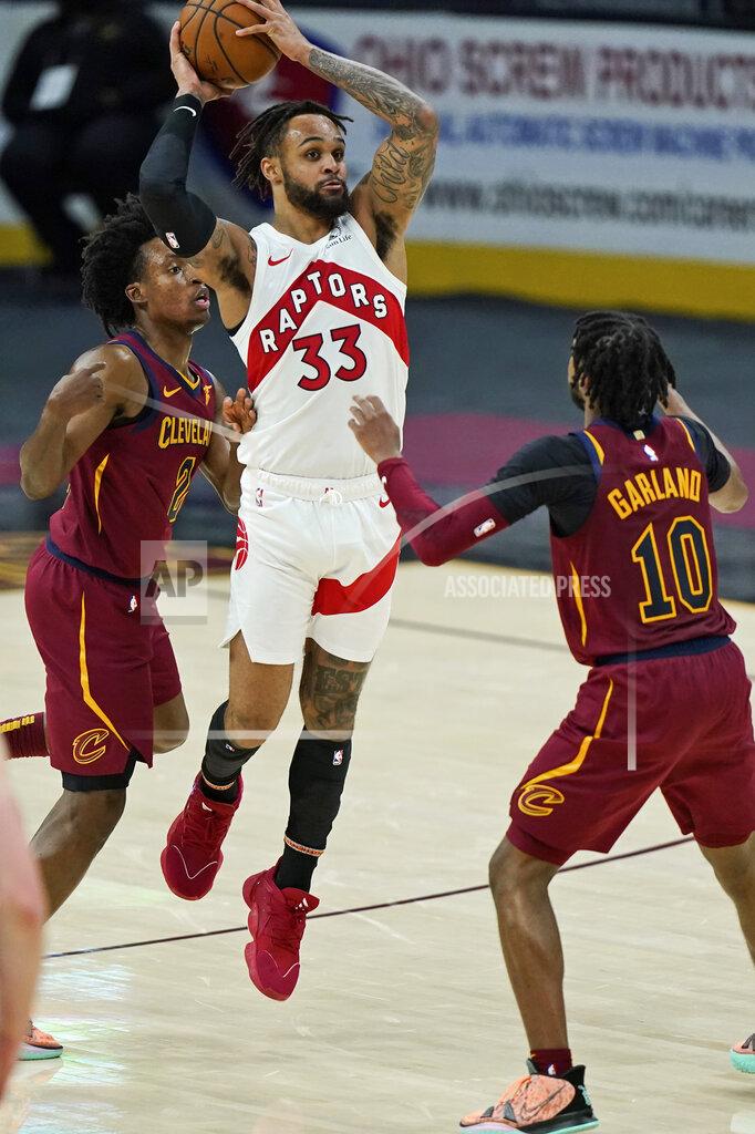 Tony Dejak Toronto Raptors' Gary Trent Jr. (33) looks to pass against Cleveland Cavaliers' Collin Sexton (2) and Darius Garland (10) in the second half of an NBA basketball game, Saturday, April 10, 2021, in Cleveland. (AP Photo/Tony Dejak)