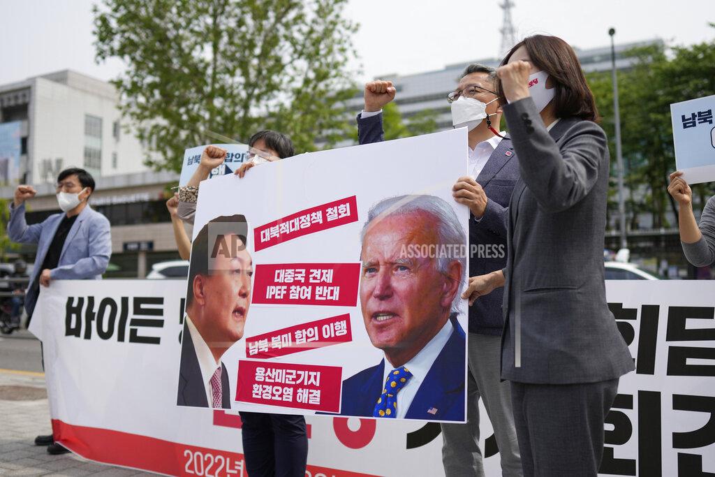 Lee Jin-Man FILE - Members of the Progressive Party shout slogans during a rally demanding the withdrawal the government's anti-North Korea policies near the presidential office in Seoul, South Korea, on May 19, 2022. The letters read "Withdrawal the hostile policies towards North Korea." When the U.S. and South Korean leaders meet Saturday, May 21, North Korea’s nuclear weapons and missile program, already a major focus, may receive extra attention if intelligence predictions of an imminent major weapons demonstration by the North, which is struggling with a COVID-19 outbreak, are right. (AP Photo/Lee Jin-man, File)