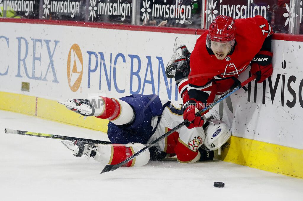 Karl B Deblaker Carolina Hurricanes' Jesper Fast (71) collides with Florida Panthers' MacKenzie Weegar (52) during the second period of an NHL hockey game in Raleigh, N.C., Sunday, March 7, 2021. (AP Photo/Karl B DeBlaker)
