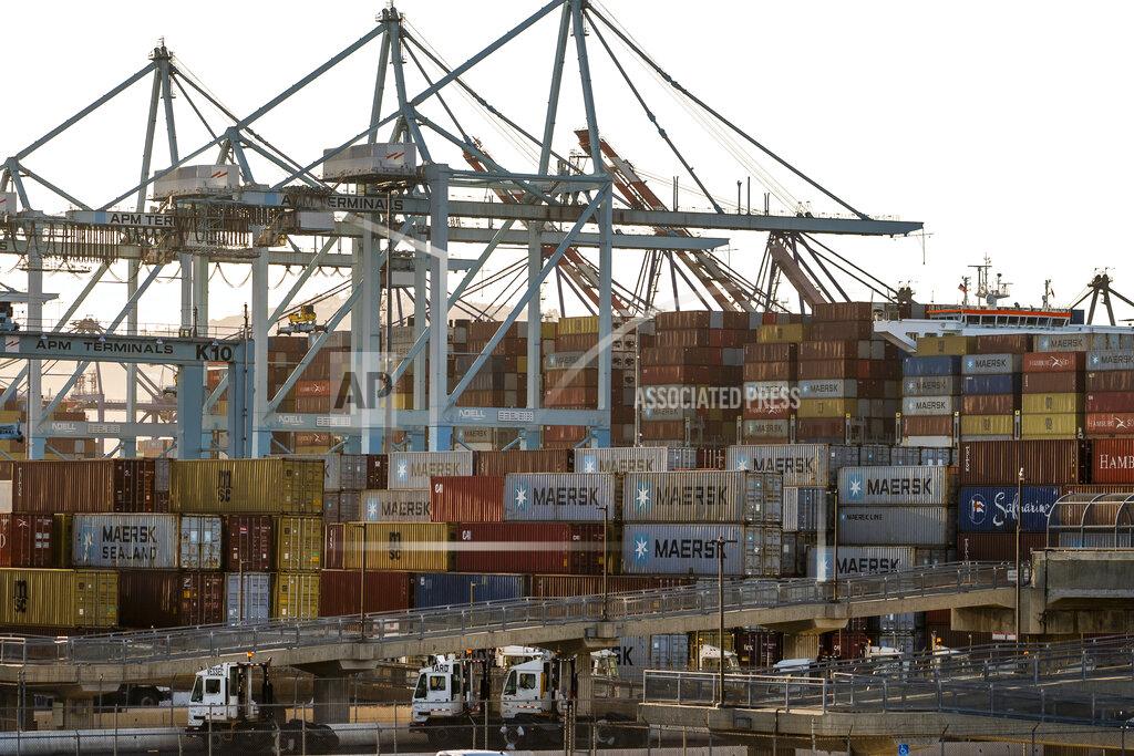 Damian Dovarganes In this Tuesday, Oct. 19, 2021, photo shipping containers are stacked up at Maersk APM Terminals Pacific at the Port of Los Angeles. California Gov, Gavin Newsom on Wednesday, Oct. 20, issued an order that aims to ease bottlenecks at the ports of Los Angeles and Long Beach that have spilled over into neighborhoods where cargo trucks are clogging residential streets. (AP Photo/Damian Dovarganes)