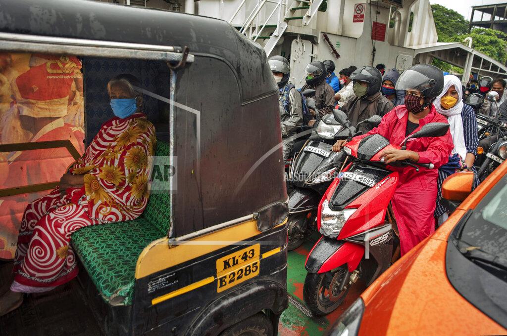 R S Iyer Commuters wearing masks as a precaution against the coronavirus travel in a ferry in Kochi, Kerala state, India, Monday, June 22 2020. India is the fourth hardest-hit country by the COVID-19 pandemic in the world after the U.S., Russia and Brazil. (AP Photo/R S Iyer)
