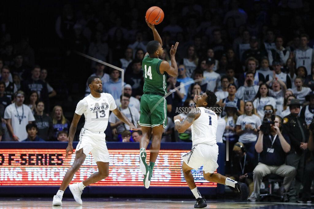 John Minchillo Jacksonville's Mo Arnold (14) shoots against Xavier's Naji Marshall (13) and Paul Scruggs (1) during the second half of an NCAA college basketball game Tuesday, Nov. 5, 2019, in Cincinnati. (AP Photo/John Minchillo)