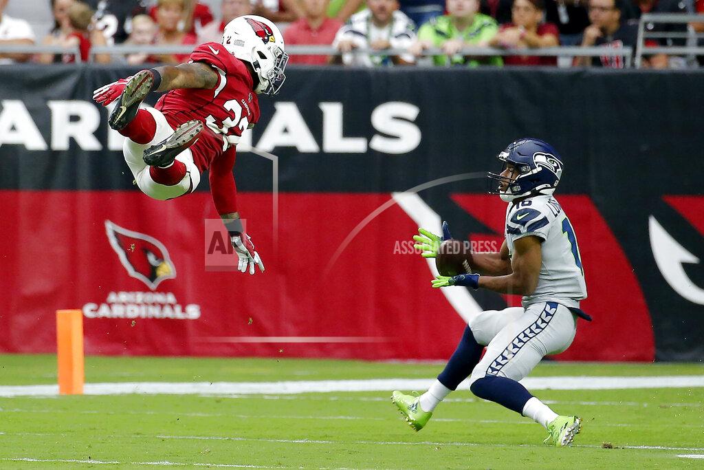Rick Scuteri Seattle Seahawks wide receiver Tyler Lockett (16) makes the catch as Arizona Cardinals strong safety Budda Baker (32) defends during the first half of an NFL football game, Sunday, Sept. 29, 2019, in Glendale, Ariz. (AP Photo/Rick Scuteri)