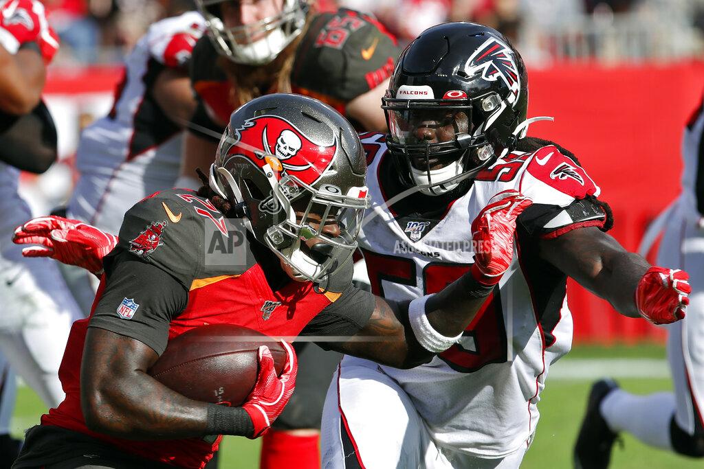 Mark Lomoglio Atlanta Falcons outside linebacker De'Vondre Campbell (59) closes in on Tampa Bay Buccaneers running back Ronald Jones II (27) on a run during the second half of an NFL football game Sunday, Dec. 29, 2019, in Tampa, Fla. (AP Photo/Mark LoMoglio)