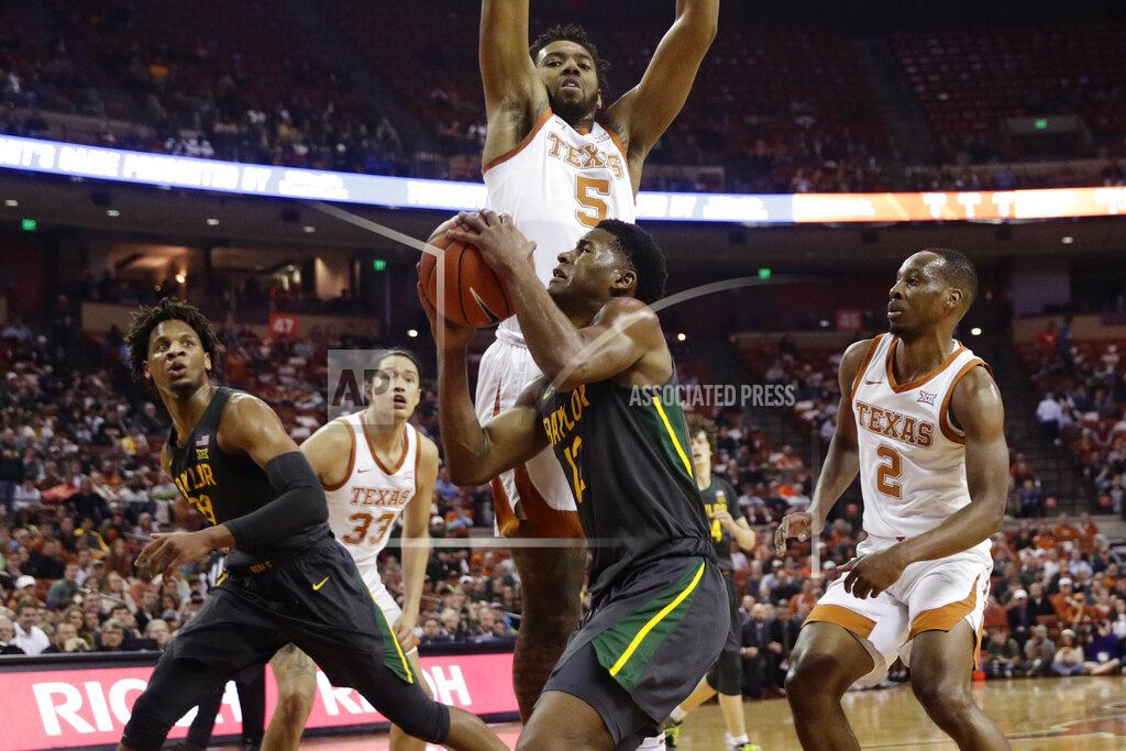 Eric Gay Baylor guard Jared Butler (12) drives to the basket against Texas forward Royce Hamm Jr. (5) during the first half of an NCAA college basketball game, Monday, Feb. 10, 2020, in Austin, Texas. (AP Photo/Eric Gay)