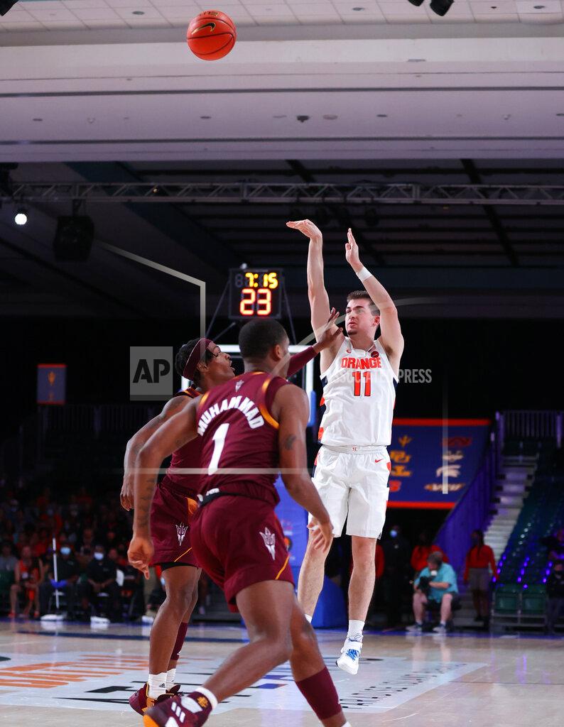 Tim Aylen In this photo provided by Bahamas Visual Services, Syracuse guard Joseph Girard III (11) shoots against Arizona State during an NCAA college basketball game at Paradise Island, Bahamas, Thursday, Nov. 25, 2021. (Tim Aylen/Bahamas Visual Services via AP)