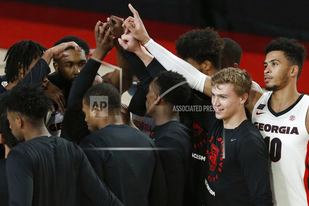 Joshua L. Jones Georgia players gather before an NCAA college basketball exhibition game against North Georgia in Athens, Ga., Wednesday, Dec. 2, 2020. (Joshua L. Jones/Athens Banner-Herald via AP)