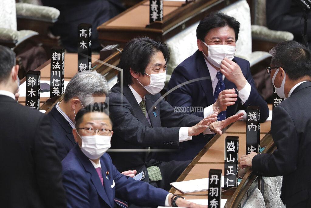 Koji Sasahara Japanese lawmakers wearing face masks to protect against the spread of the coronavirus attend an ordinary Diet session at the House of Representatives of parliament in Tokyo Monday, Jan. 18, 2021. (AP Photo/Koji Sasahara)