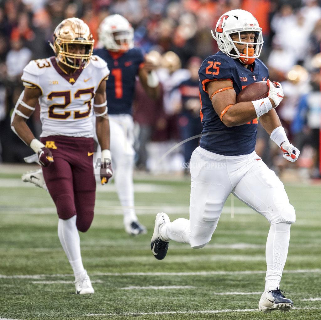 Holly Hart Illinois running back Dre Brown (25) takes the ball to the end zone as Minnesota's Jordan Howden (23)defends in the first half of an NCAA college football game, Saturday, Nov. 3, 2018, in Champaign, Ill. (AP Photo/Holly Hart)