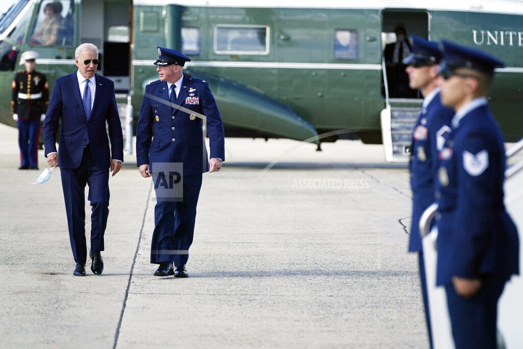 Evan Vucci President Joe Biden speaks with Colonel William (Chris) McDonald, Vice Commander, 89th Air Wing before boarding Air Force One for a trip to New York to attend the United Nations General Assembly, Monday, Sept. 20, 2021, at Andrews Air Force Base, Md. (AP Photo/Evan Vucci)
