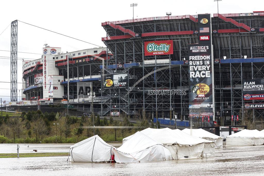 Wade Payne Damaged vendor tents sit in a flooded area near Bristol Motor Speedway as races for both the Truck Series and NASCAR Cup Series auto race was postponed due to inclement weather, Sunday, March 28, 2021, in Bristol, Tenn. (AP Photo/Wade Payne)
