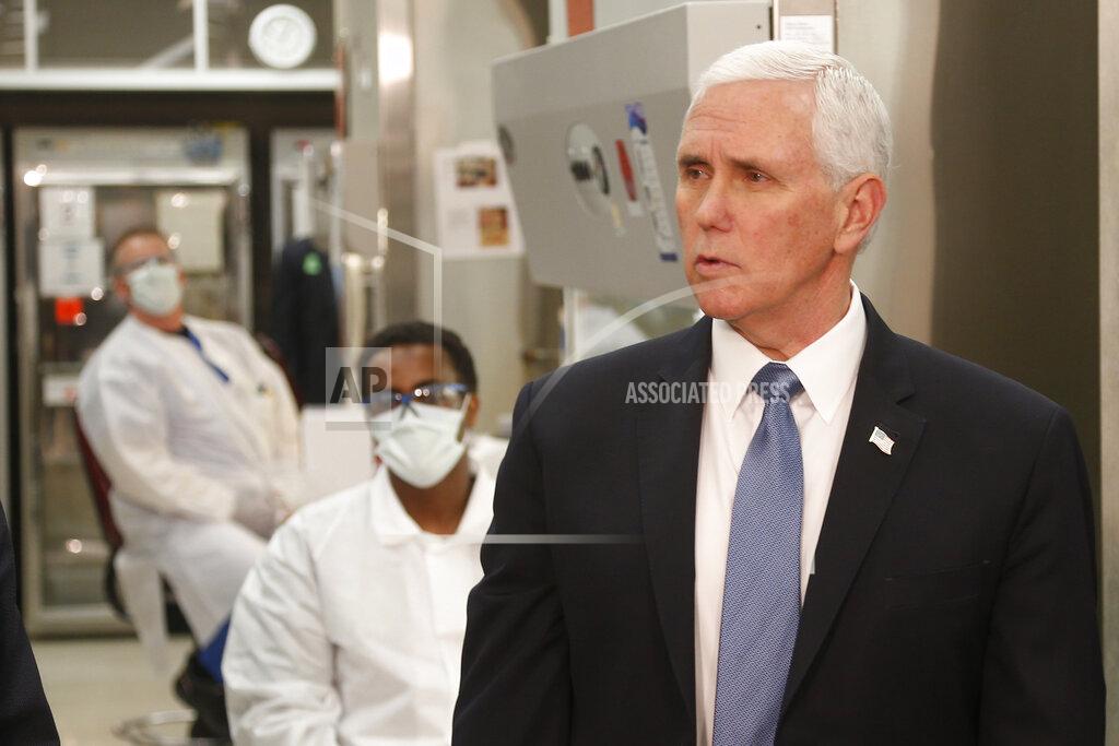 Jim Mone Vice President Mike Pence visits the molecular testing lab at Mayo Clinic Tuesday, April 28, 2020, in Rochester, Minn., where he toured the facilities supporting COVID-19 research and treatment. Pence chose not to wear a face mask while touring the Mayo Clinic in Minnesota. It's an apparent violation of the world-renowned medical center's policy requiring them. (AP Photo/Jim Mone)