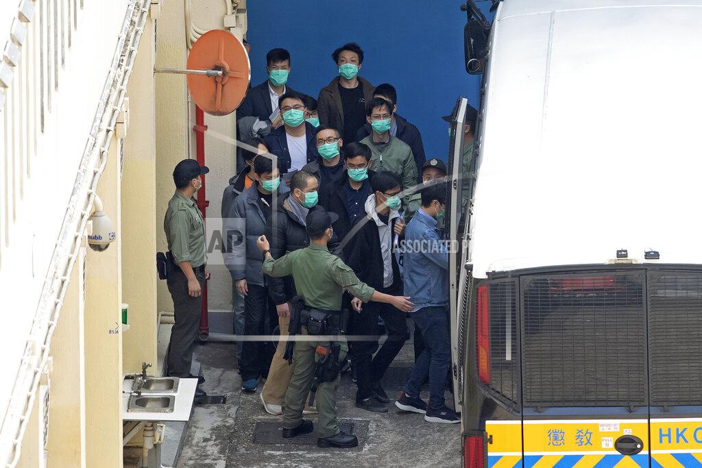 Kin Cheung FILE - In this Tuesday, March 2, 2021, file photo, some of the 47 democracy activists are escorted by Correctional Services officers in Hong Kong. In the semi-autonomous city of Hong Kong, China is moving to eliminate the possibility of opposition politicians gaining office, saying only patriots loyal to the Communist Party can have a role in government. (AP Photo/Kin Cheung, File)