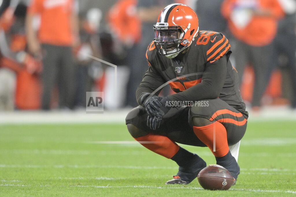 David Richard FILE - In this Sept. 22, 2019, file photo, Cleveland Browns defensive tackle Larry Ogunjobi (65) reacts during an NFL football game against the Los Angeles Rams in Cleveland. The Browns will be without one of their best defensive players Sunday against Indianapolis as Ogunjobi will sit out with an abdominal injury. (AP Photo/David Richard, File)