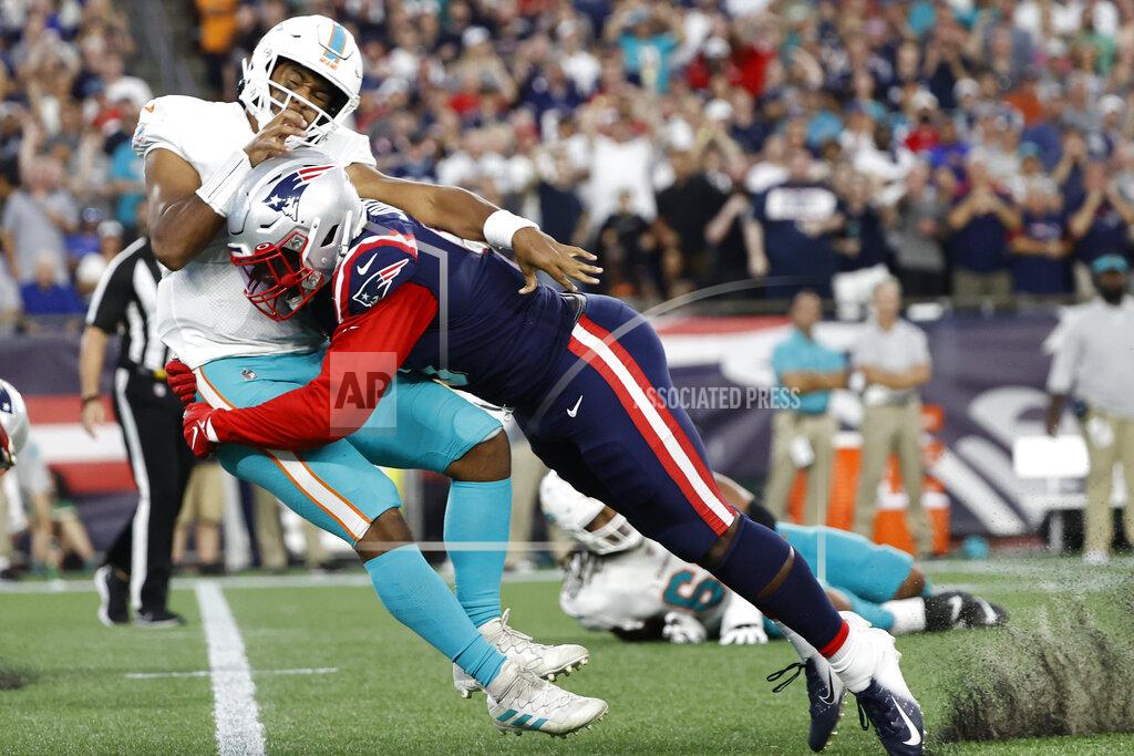 Winslow Townson New England Patriots outside linebacker Matt Judon (9) tackles Miami Dolphins quarterback Tua Tagovailoa (1) during the second half of an NFL football game, Sunday, Sept. 12, 2021, in Foxborough, Mass. (AP Photo/Winslow Townson)
