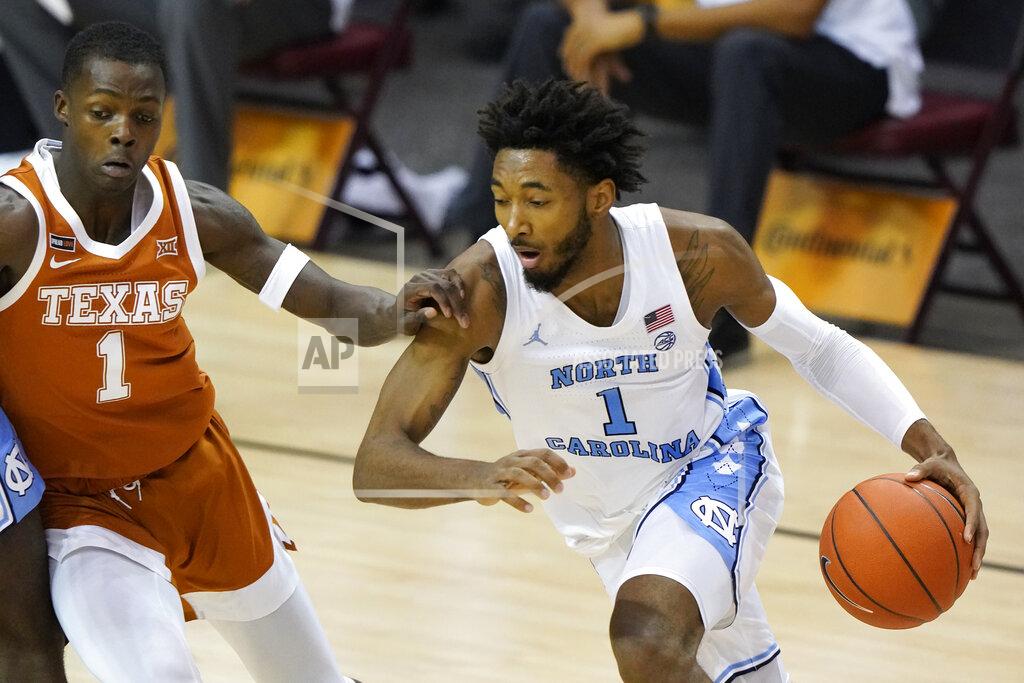 Kathy Kmonicek North Carolina guard Leaky Black (1) drives the ball against Texas guard Andrew Jones (1) in the first half of an NCAA college basketball game for the championship of the Maui Invitational, Wednesday, Dec. 2, 2020, in Asheville, N.C. (AP Photo/Kathy Kmonicek)
