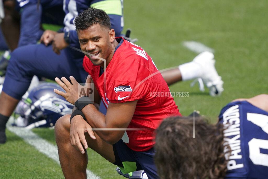 Ted S. Warren Seattle Seahawks quarterback Russell Wilson stretches at the start of NFL football practice Tuesday, June 8, 2021, in Renton, Wash. (AP Photo/Ted S. Warren)