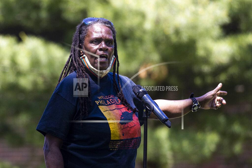 In this May 15, 2021 photo, Consuewella Africa, 69, speaks during a gathering for the 36th Anniversary of the MOVE Bombing in Philadelphia. Consuewella Dotson Africa, a longtime member of the Black organization MOVE and mother of two children killed in the 1985 bombing of the group's home in Philadelphia, died on Wednesday, June 16, 2021 in a hospital. She was 67. (Tyger Williams/The Philadelphia Inquirer via AP)