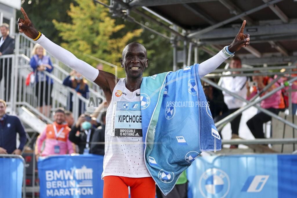 Christoph Soeder Kenya's Eliud Kipchoge celebrates after winning the Berlin Marathon in Berlin, Germany, Sunday, Sept. 25, 2022. Olympic champion Eliud Kipchoge has bettered his own world record in the Berlin Marathon. Kipchoge clocked 2:01:09 on Sunday to shave 30 seconds off his previous best-mark of 2:01:39 from the same course in 2018. (AP Photo/Christoph Soeder)