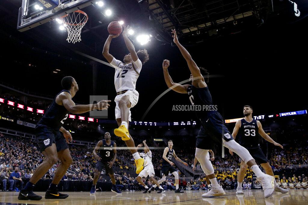 Charlie Riedel Missouri guard Dru Smith (12) shoots during the first half of an NCAA college basketball game against Butler, Monday, Nov. 25, 2019, in Kansas City, Mo. (AP Photo/Charlie Riedel)