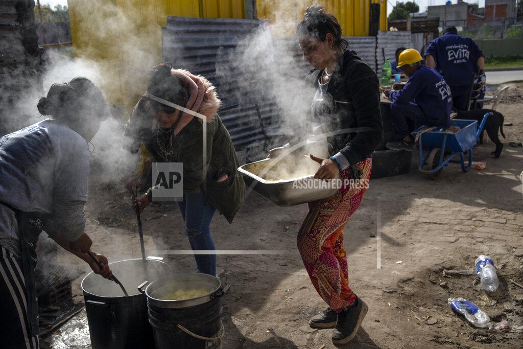 Rodrigo Abd Women cook at a soup kitchen to feed residents in the Puerta de Hierro neighborhood, in La Matanza district of Buenos Aires, Argentina, Wednesday, May 11, 2022. Argentines have lived with double-digit inflation for years, but the latest increase in prices is causing more to rely on food aid. (AP Photo/Rodrigo Abd)