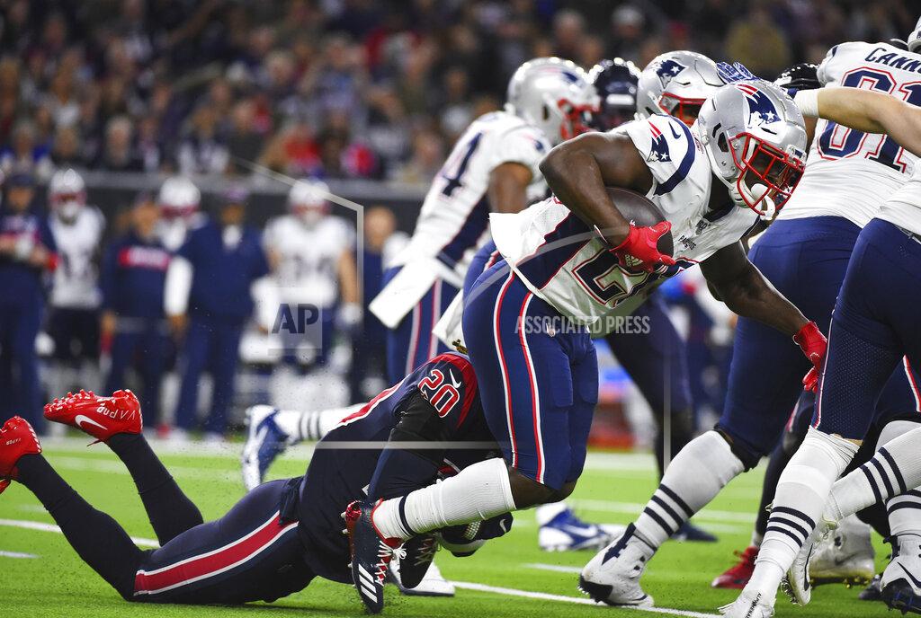 Eric Christian Smith New England Patriots running back Sony Michel (26) is hit by Houston Texans strong safety Justin Reid (20) on a run during the first half of an NFL football game Sunday, Dec. 1, 2019, in Houston. (AP Photo/Eric Christian Smith)