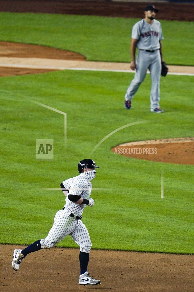 Frank Franklin Ii New York Yankees' Clint Frazier, below, passes Boston Red Sox's Nathan Eovaldi as he runs the bases after hitting a three-run home run during the sixth inning of a baseball game Saturday, Aug. 15, 2020, in New York. (AP Photo/Frank Franklin II)
