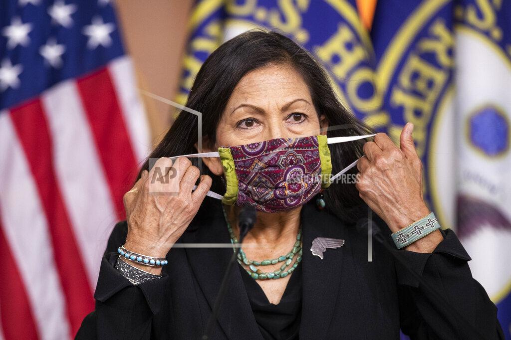 Manuel Balce Ceneta Rep. Debra Haaland, D-N.M. removes her face mask to speak during a news conference on Capitol Hill, Wednesday, May 27, 2020, in Washington. (AP Photo/Manuel Balce Ceneta)