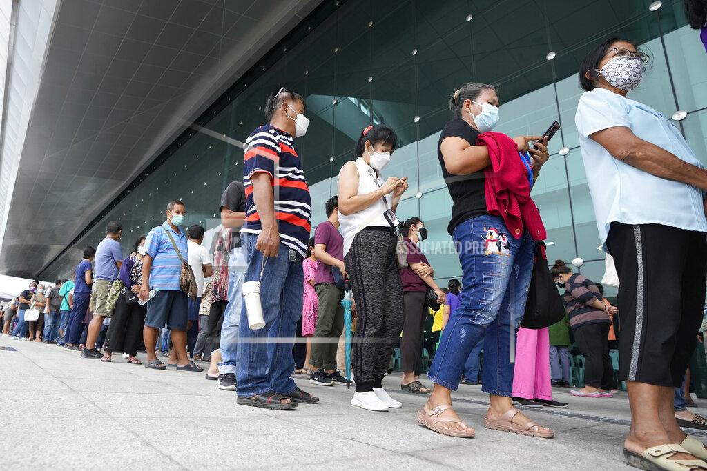 Sakchai Lalit Residents wait on line to receive shots of the AstraZeneca COVID-19 vaccine at the Central Vaccination Center in Bangkok, Thailand, Thursday, July 22, 2021. (AP Photo/Sakchai Lalit)