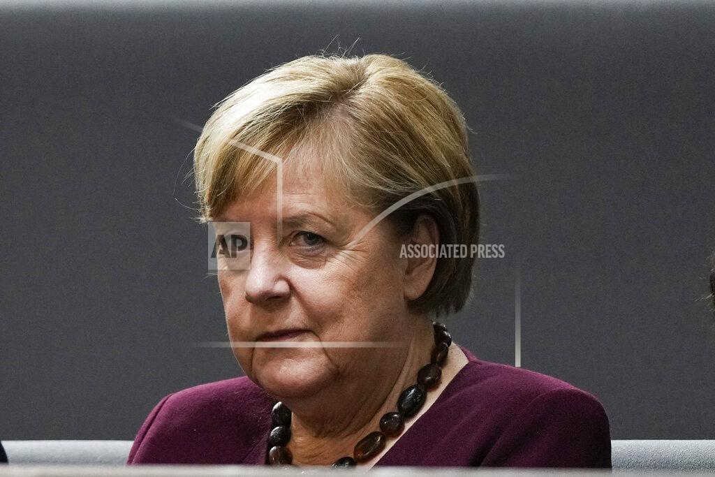 Markus Schreiber Chancellor Abgela Merkel sits on the visitors tribune as she attends the constituent session of German parliament at the Reichstag building in Berlin, Tuesday, Oct. 26, 2021. Following the national elections on September 26th, the parliament Bundestag meet for the constituent parliamentary session. (AP Photo/Markus Schreiber)