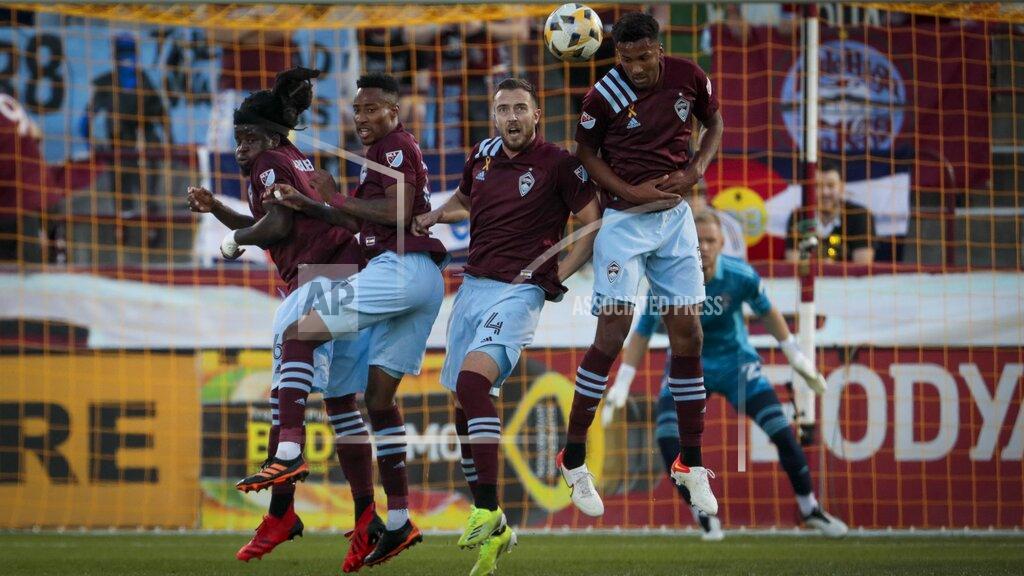 Joe Mahoney Colorado Rapids' Lalas Abubakar (6), Mark-Anthony Kaye, second from left, Danny Wilson (4) and Auston Trusty (5) block a penalty shot by Toronto FC in the first half of an MLS soccer game in Denver, Saturday, Sept. 25, 2021. (AP Photo/Joe Mahoney)
