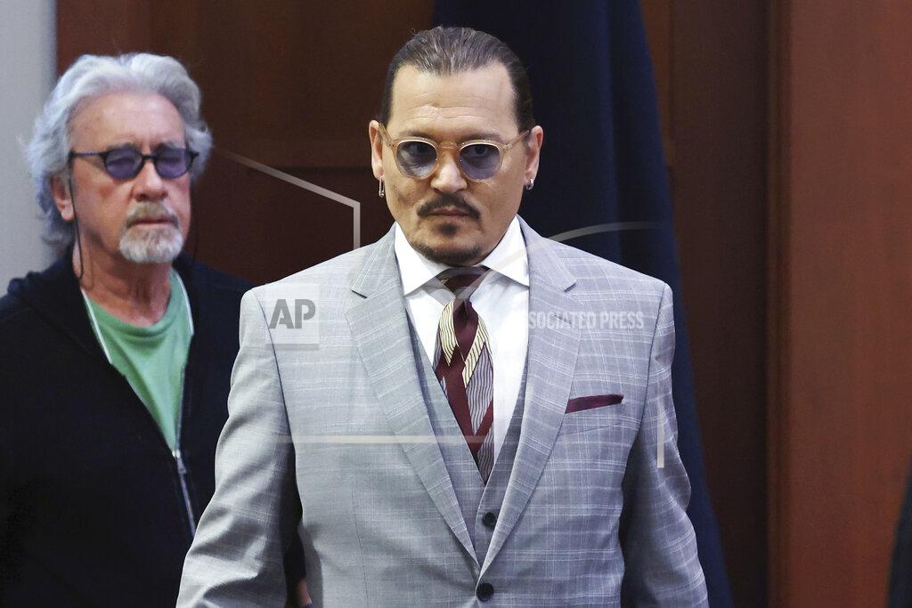 Michael Reynolds Actor Johnny Depp arrives in the courtroom in the Fairfax County Circuit Courthouse in Fairfax, Va., Thursday, May 26, 2022. Actor Johnny Depp sued his ex-wife Amber Heard for libel in Fairfax County Circuit Court after she wrote an op-ed piece in The Washington Post in 2018 referring to herself as a "public figure representing domestic abuse." (Michael Reynolds/Pool Photo via AP)