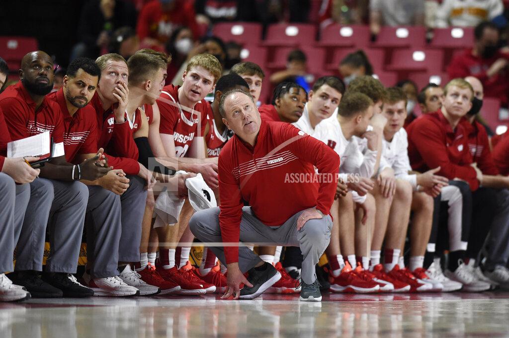 Gail Burton Wisconsin head coach Greg Gard, center, looks at the scoreboard as Maryland takes the lead in the second half of an NCAA college basketball game on Sunday, Jan. 9, 2022, in College Park, Md. (AP Photo/Gail Burton)