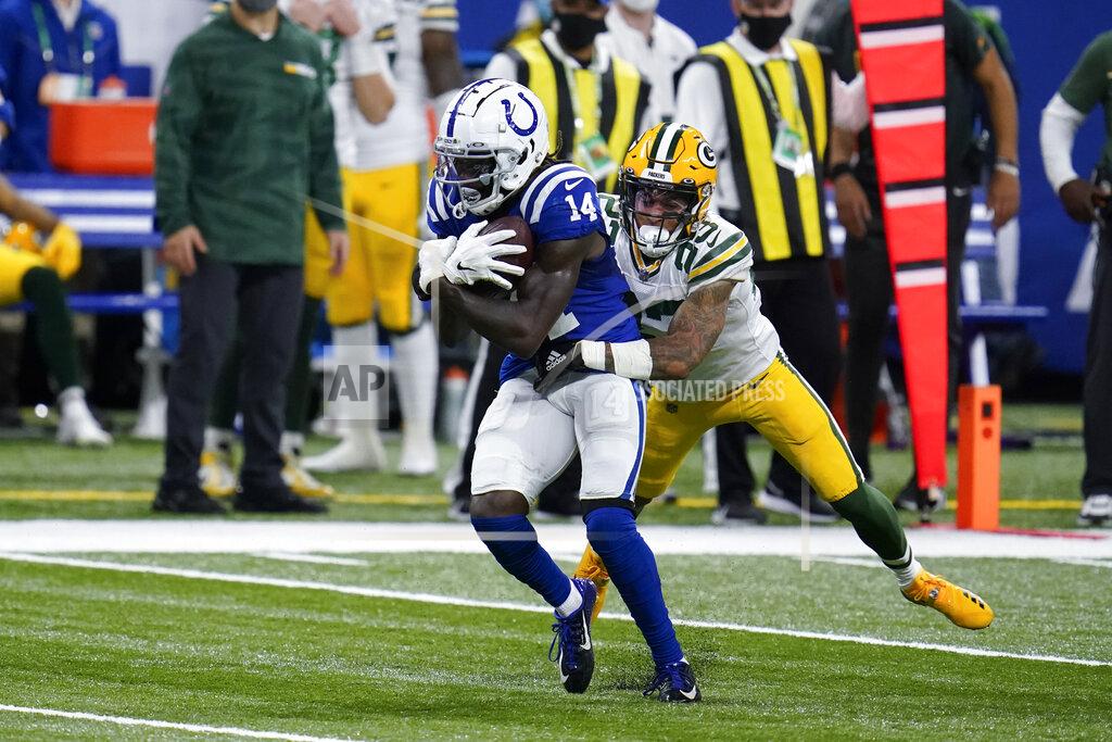 Michael Conroy Indianapolis Colts' Zach Pascal (14) is tackled by Green Bay Packers' Jaire Alexander (23) during the second half of an NFL football game, Sunday, Nov. 22, 2020, in Indianapolis. (AP Photo/Michael Conroy)