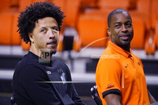 Sue Ogrocki Cade Cunningham, left, and Oklahoma State head coach Mike Boynton Jr., right, announce that Cunningham will enter the NBA draft after a dynamic freshman season that saw him named a first-team AP All-American, Thursday, April 1, 2021, in Stillwater, Okla. (AP Photo/Sue Ogrocki)