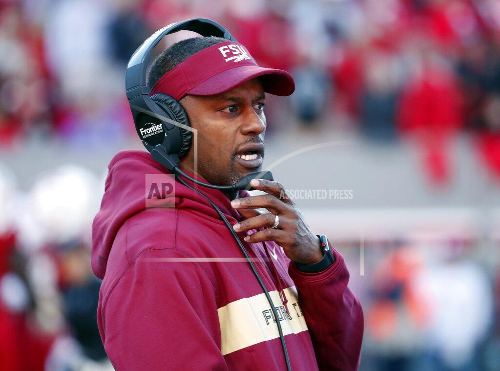 Chris Seward FILE - In this Saturday, Nov. 3, 2018 file photo, Florida State head coach Willie Taggart confers on his headset during the first half of an NCAA college football game against North Carolina State in Raleigh, N.C. Florida State and Miami were hoping signing day could help put to the negativity of 2018 to rest and provide a push toward better times. Coming off a 5-7 record in their first season under coach Willie Taggart, the Seminoles landed a top 20 class but struck out on a much-needed quarterback Wednesday, Feb. 6, 2019. (AP Photo/Chris Seward, File)