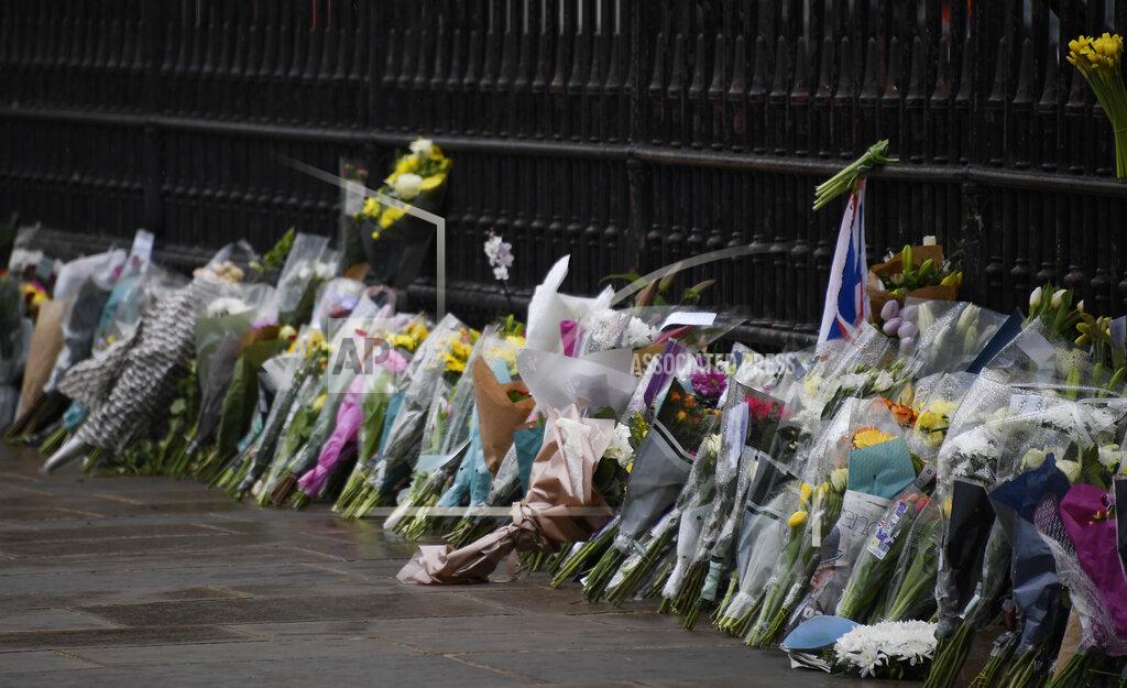Alberto Pezzali Flowers line the sidewalk in front of the gate outside Buckingham Palace in London, a day after the death of Britain's Prince Philip, Saturday, April 10, 2021. Britain's Prince Philip, the irascible and tough-minded husband of Queen Elizabeth II who spent more than seven decades supporting his wife in a role that mostly defined his life, died on Friday. (AP Photo/Alberto Pezzali)