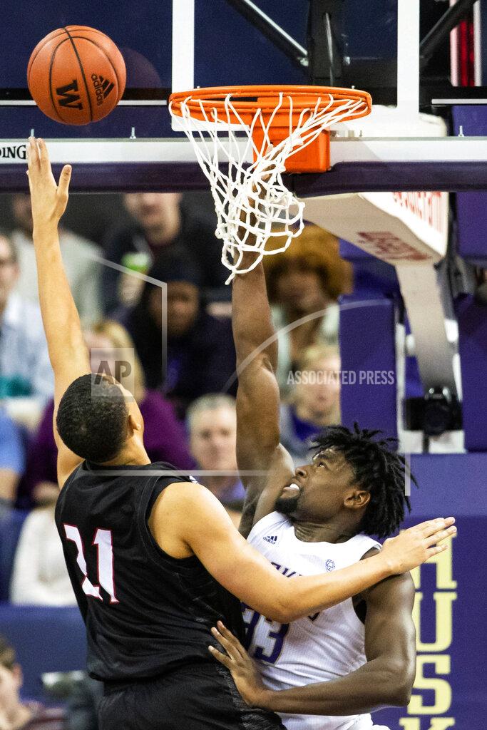 Andy Bao Seattle guard Riley Grigsby (11) misses the basket as Washington forward Isaiah Stewart (33) defends during the first half of an NCAA college basketball game, Tuesday, Dec. 17, 2019, in Seattle. (Andy Bao/The Seattle Times via AP)